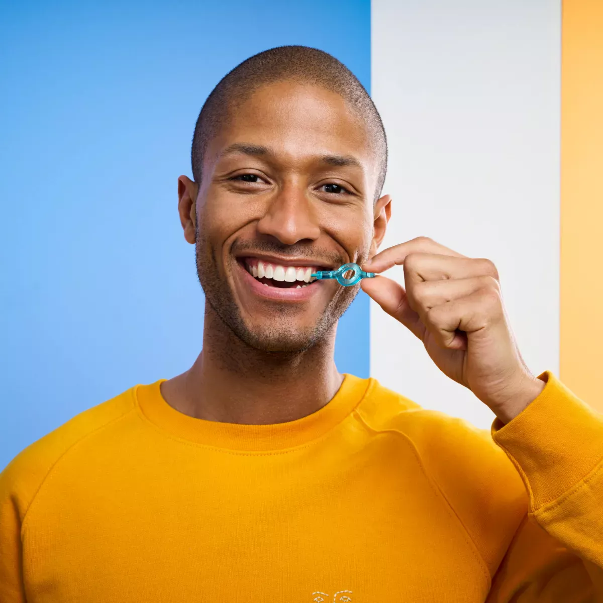 Man using interdental brush
