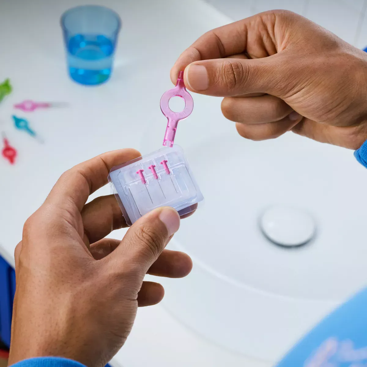 Hands holding interdental brush