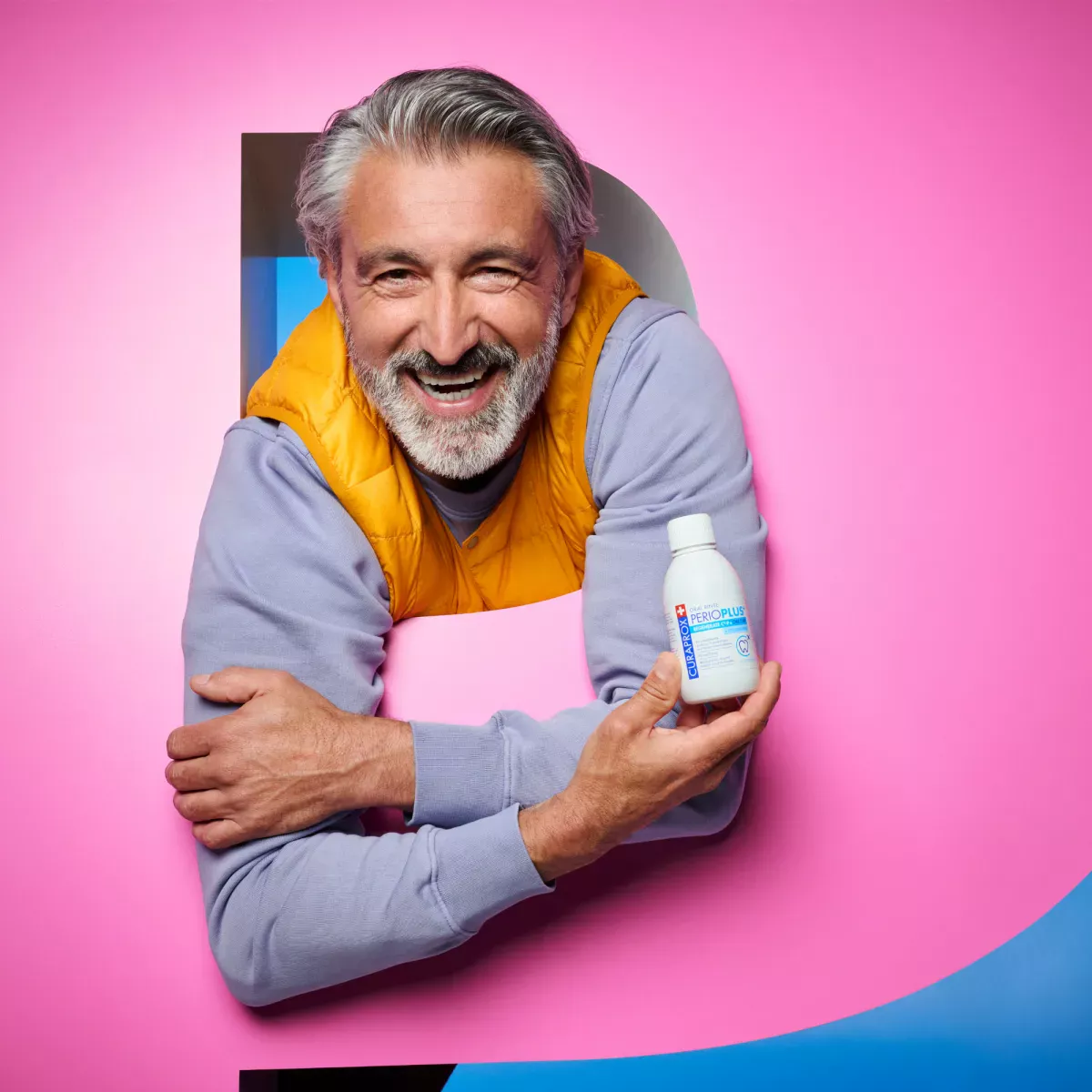 Man holding mouthwash bottle
