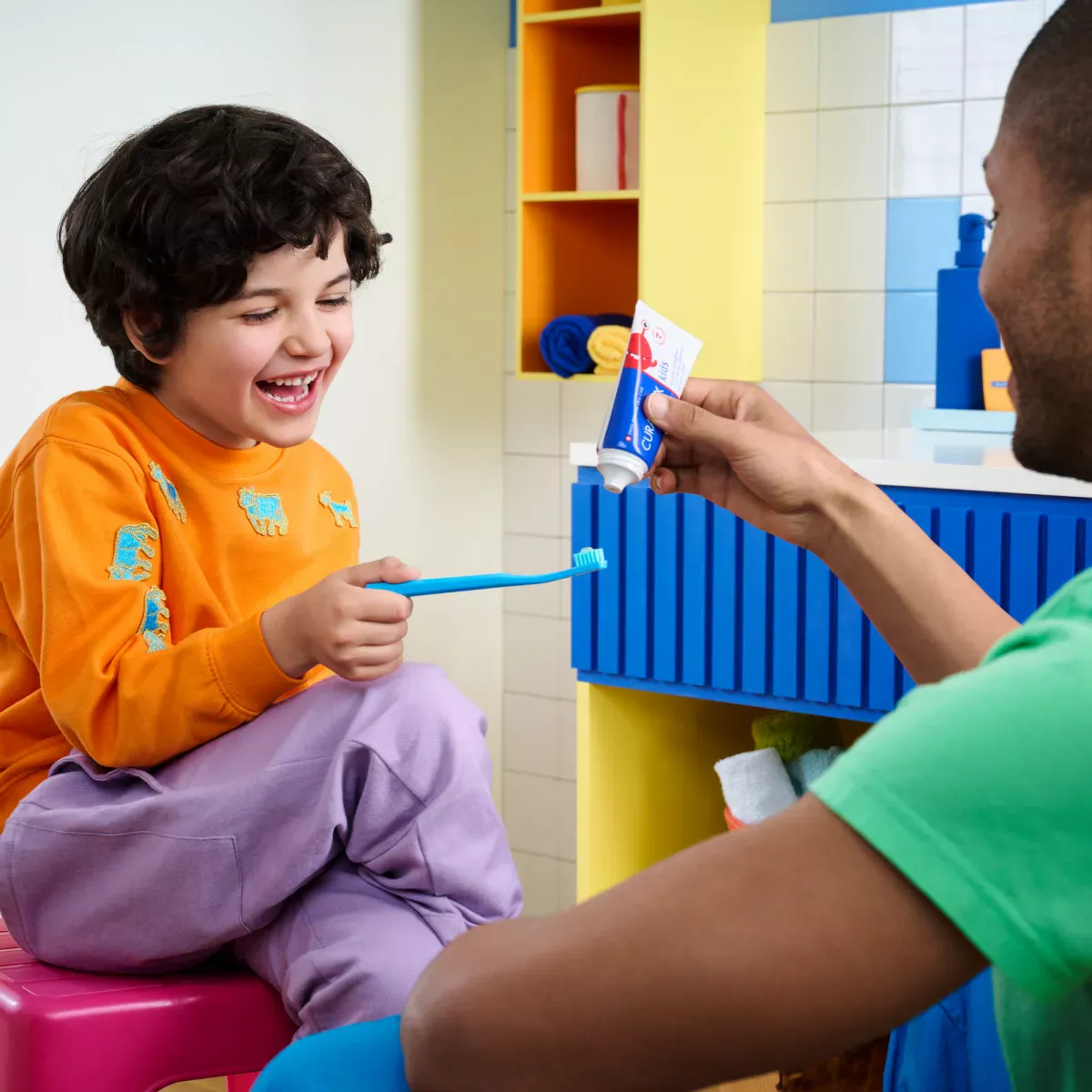 Kid is using toothpaste